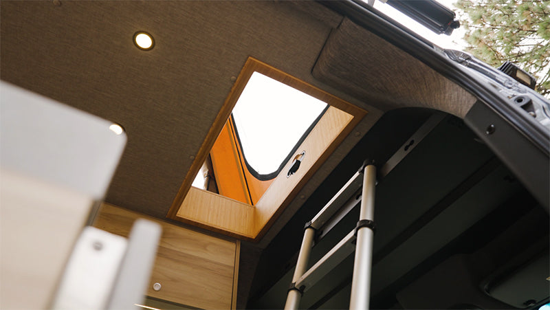 Interior of a Mercedes Sprinter Van with CloudCap van tent poptop.