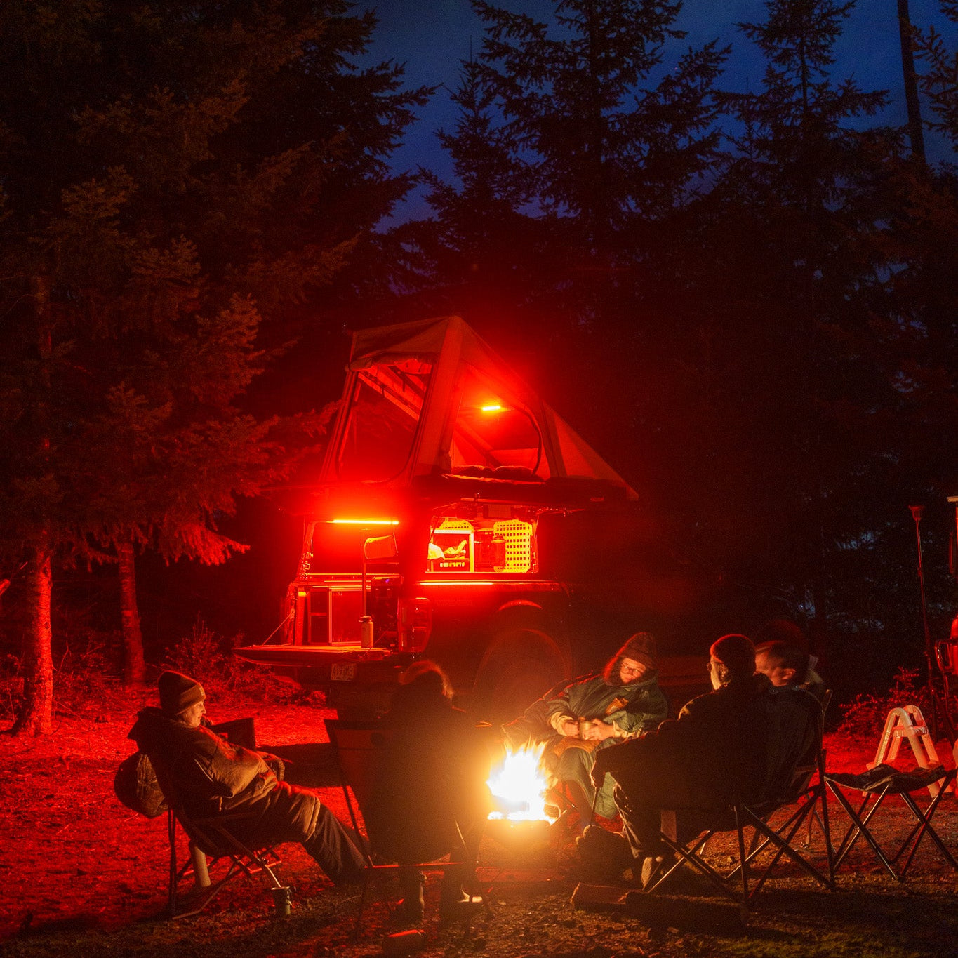Super Pacific X1 truck camper with lighting kit in red mode.