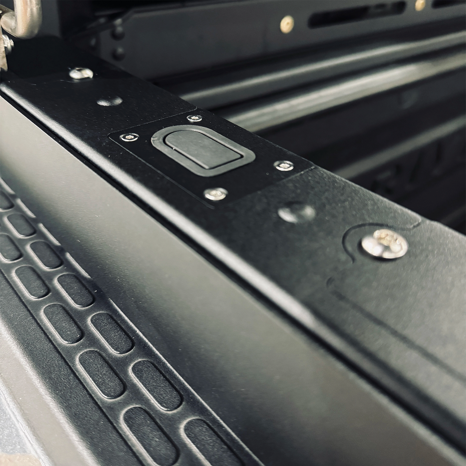 Rivian R1T with Super Pacific X1 Camper featuring integrated operable Gear Tunnel buttons.