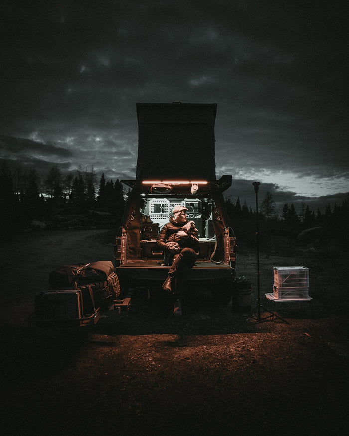 Truck camper parked in the desert at sunset with glowing dust, illustrating protection from heat, dust, and rodents