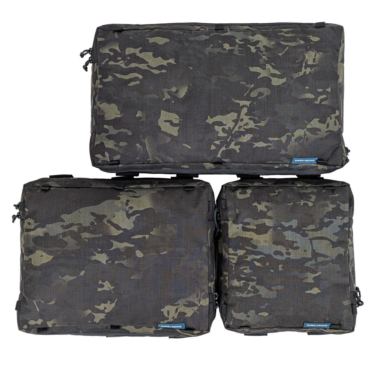 Three camouflage-patterned Super Pacific SideKick Door bags stacked on a white background