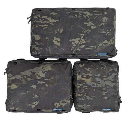 Three camouflage-patterned Super Pacific SideKick Door bags stacked on a white background