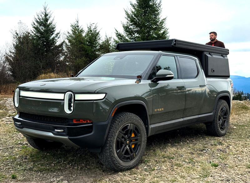 Rivian R1T with X1 camper closed for driving