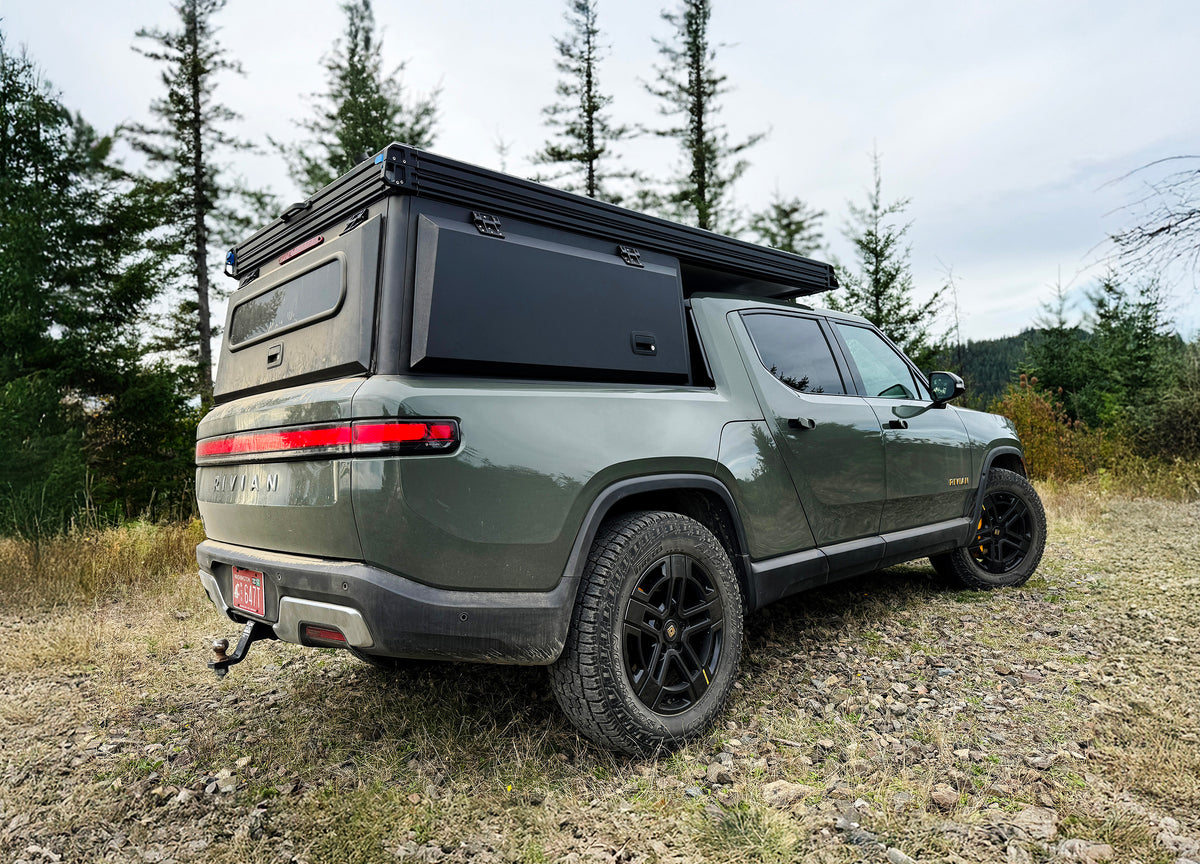 Rear view of Rivian R1T with X1 truck camper