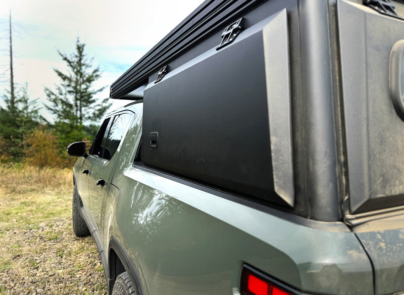 Rivian R1T equipped with a lightweight X1 truck camper