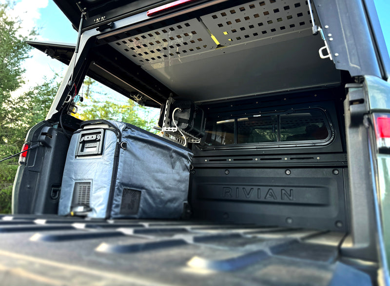 Interior storage and accessory mounting in Rivian R1T X1 camper