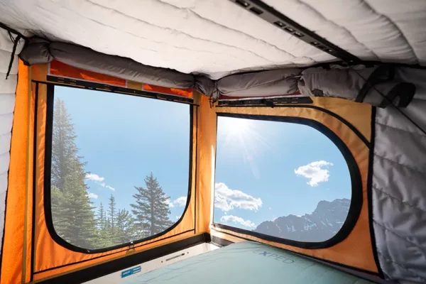 X1 Camper with Insulation Kit installed looking out at a mountain top.