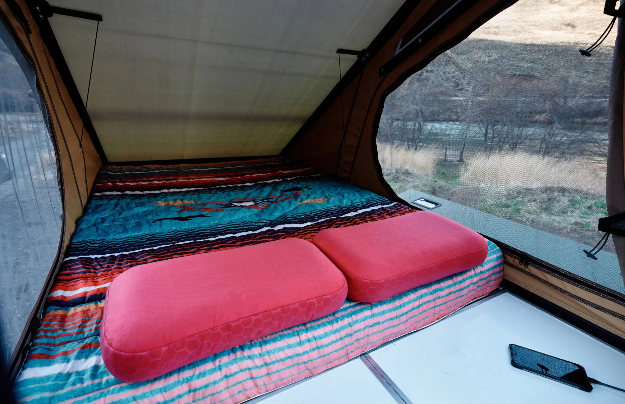 Interior of Super Pacific X1 camper's bed platform with ExPed mattress.