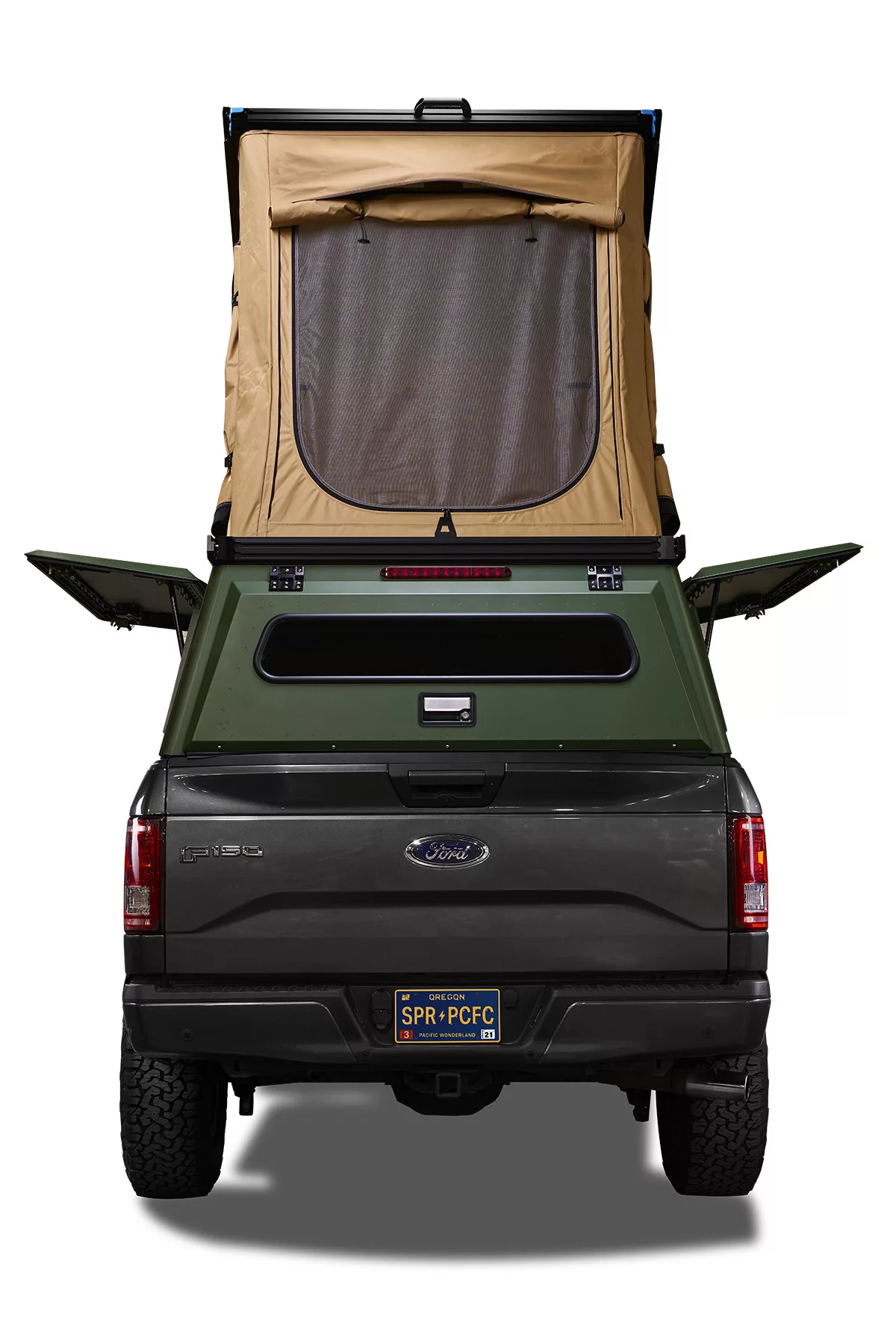 Rear view of Ford F150 with X1 Truck Camper mounted on the back, with the tent open.